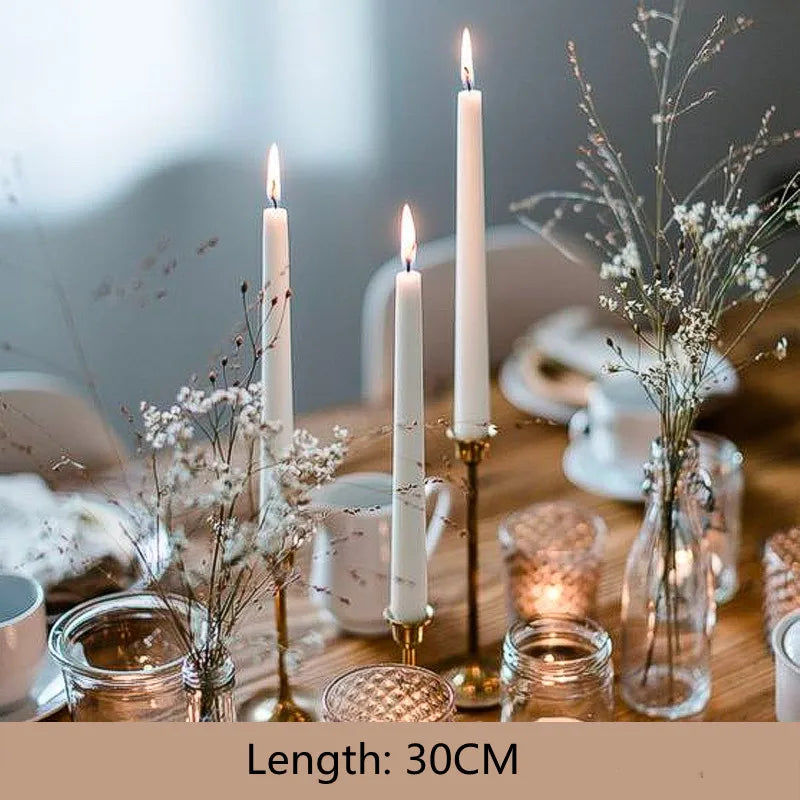 Cera taper candles on a dinner table