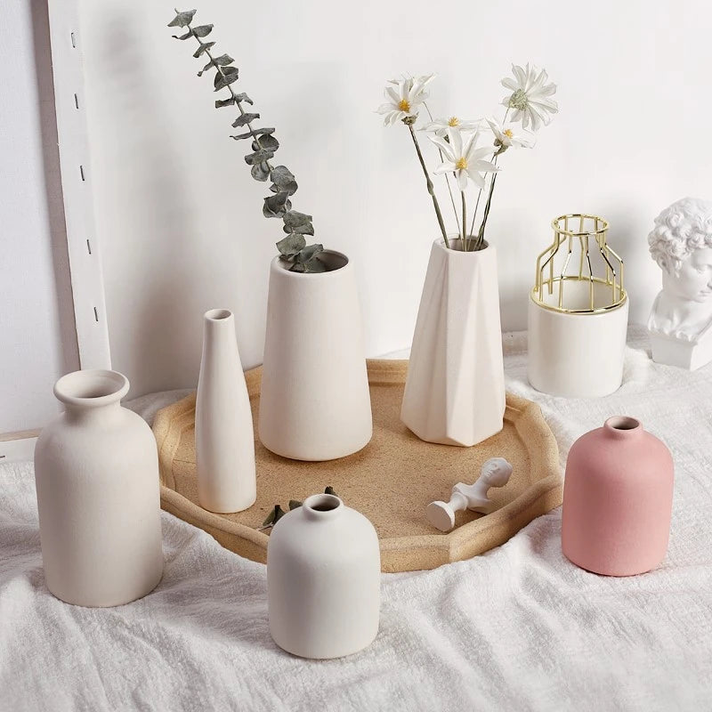 Latte vases with small flowers
