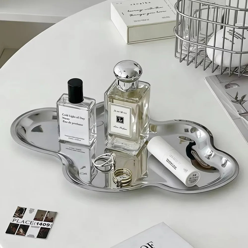 Nuvoletta silver cloud tray with a perfume bottle
