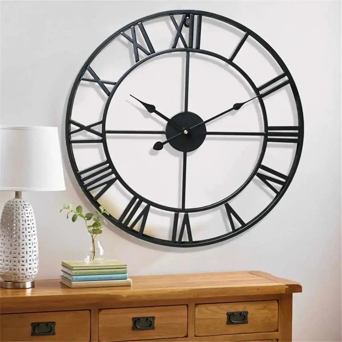 Roma black wall clock above a sideboard