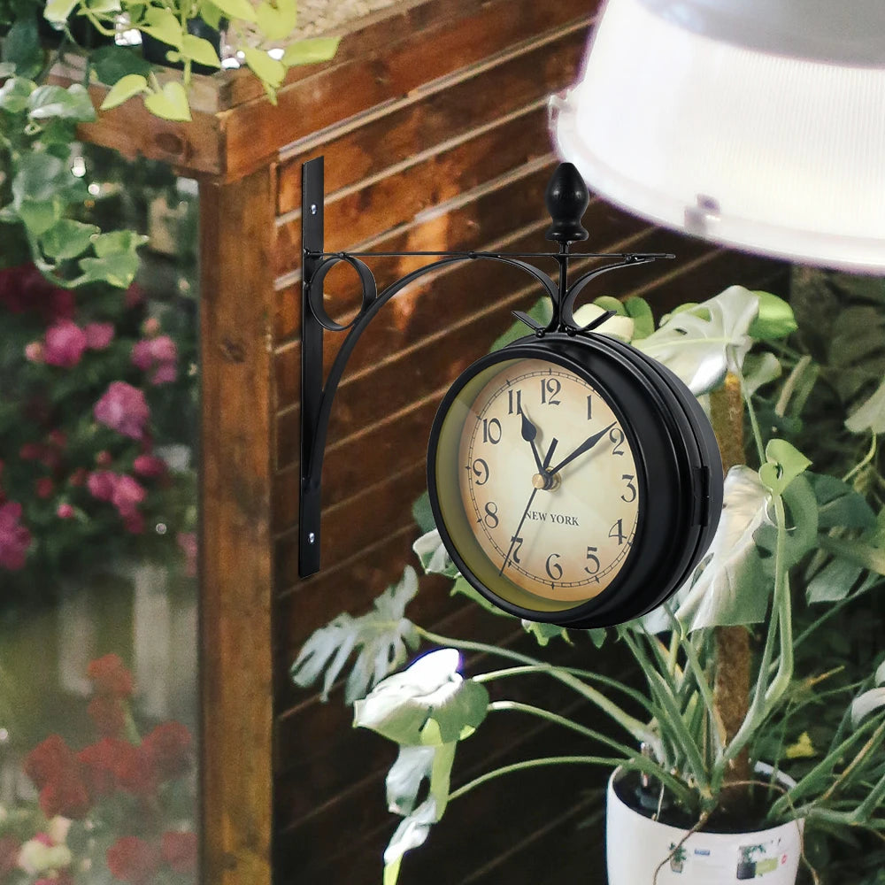 Stazione clock on a garden wall